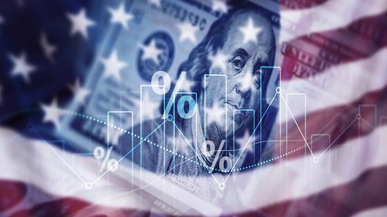 Dollar bill, US flag and financial chart
