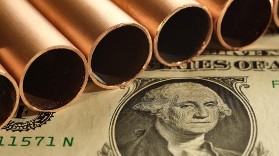 Copper pipes on a US dollar bill